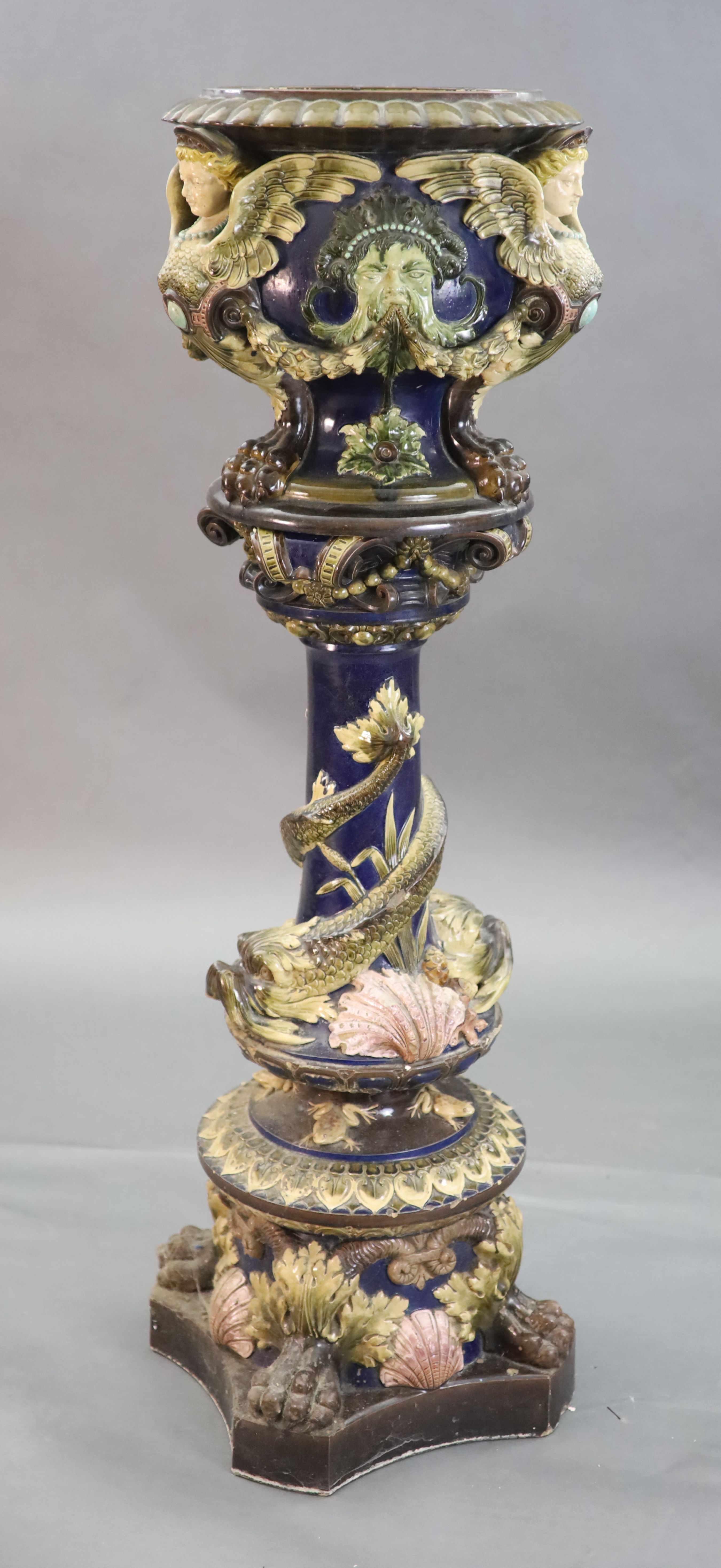 A Continental Palissy style grotesque pottery jardiniere and associated pedestal, late 19th century, total height 134cm